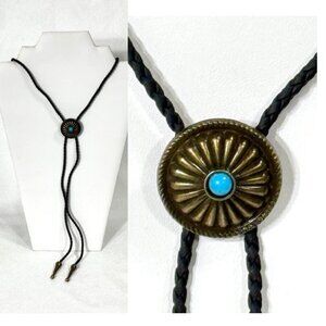Gold-tone and black cord bolo tie.